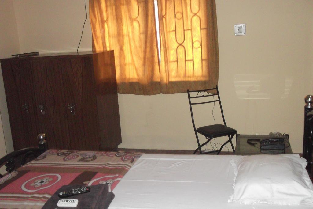 Megacity Inn Calcutta Værelse billede